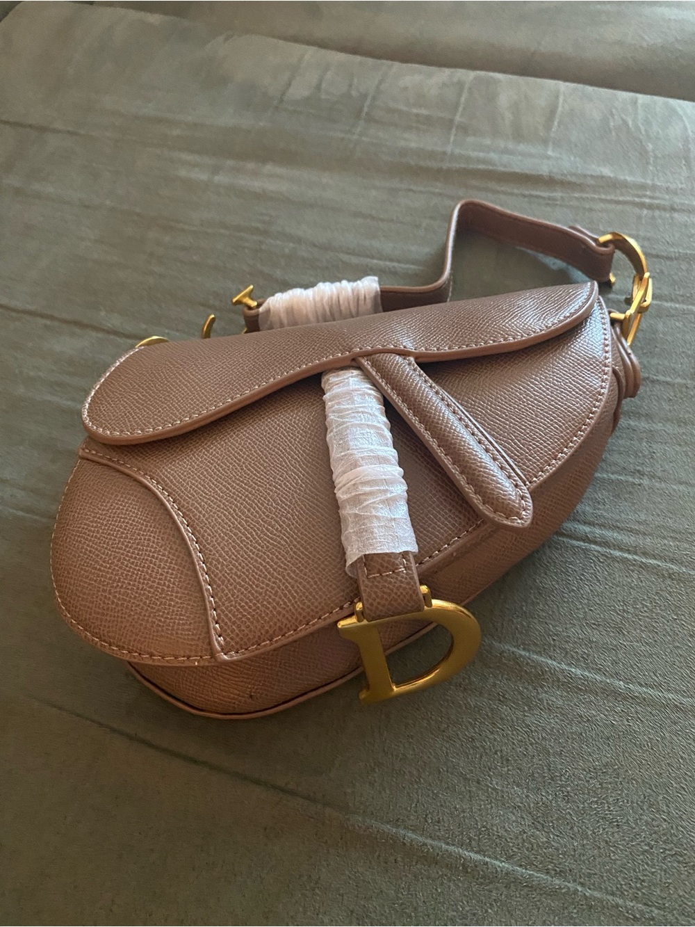 Pebbled Taupe Saddle Crossbody with Gold D Accent
